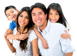 A family in front of a white background to represent life insurance
